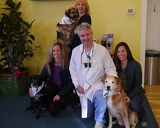 SPECIAL TO THE VINDICATOR
Dr. Joseph Bedich of the Center for Progressive Dentistry, Cortland, has participated in the fundraising program Smiles for Life for 16 years. The program is sponsored by Crown Council, which allows people to get custom teeth-whitening at a discounted price with the proceeds going to a charity organization. This year, the organization is Animal Pawtectors, which rehabilitates and treats rescued animals until they can be adopted. To schedule a teeth-whitening appointment, call the office at 330-637-7971. Staff members, from left, are Diane King, Linda Stefanish, Bedich and Sarah Ulam with Zippy, Oliver and Lilly.