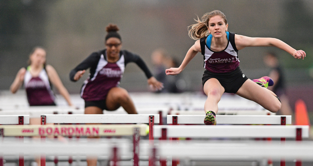 BOARDMAN, OHIO - APRIL 11, 2017: Jessica Knickerbocker of Boardman clears a hurdle while racing to the finish line during her head of the girls 100 meter hurdles, Tuesday afternoon at Spartan Stadium. DAVID DERMER | THE VINDICATOR