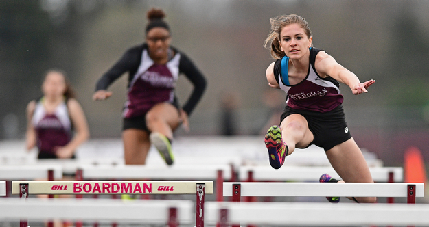 BOARDMAN, OHIO - APRIL 11, 2017: Jessica Knickerbocker of Boardman clears a hurdle while racing to the finish line during her head of the girls 100 meter hurdles, Tuesday afternoon at Spartan Stadium. DAVID DERMER | THE VINDICATOR