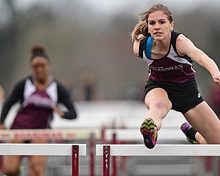 BOARDMAN, OHIO - APRIL 11, 2017: Jessica Knickerbocker of Boardman clears a hurdle while racing to the finish line during her head of the girls 100 meter hurdles, Tuesday afternoon at Spartan Stadium. DAVID DERMER | THE VINDICATOR