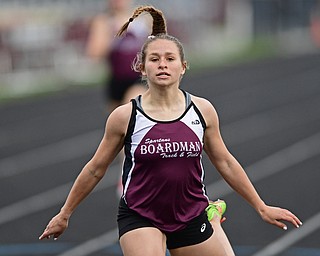 BOARDMAN, OHIO - APRIL 11, 2017: Cassie Stitt of Boardman crosses the finish line after winning her heat of the girls 400 meter run, Tuesday afternoon at Spartan Stadium. DAVID DERMER | THE VINDICATOR