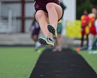 BOARDMAN, OHIO - APRIL 11, 2017: Brigita Ositis of Boardman flies through the air on her way to the sand pit during the girls long jump, Tuesday afternoon at Spartan Stadium. DAVID DERMER | THE VINDICATOR