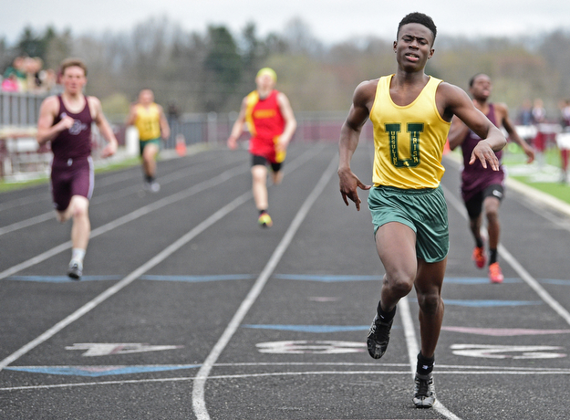 BOARDMAN, OHIO - APRIL 11, 2017: Guy-Michael Kaho of Ursuline crosses the finish line after winning his heat of the boys 400 meter dash, Tuesday afternoon at Spartan Stadium. DAVID DERMER | THE VINDICATOR