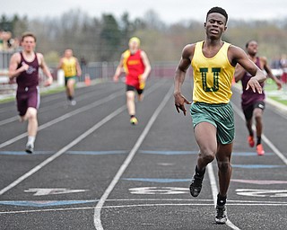 BOARDMAN, OHIO - APRIL 11, 2017: Guy-Michael Kaho of Ursuline crosses the finish line after winning his heat of the boys 400 meter dash, Tuesday afternoon at Spartan Stadium. DAVID DERMER | THE VINDICATOR