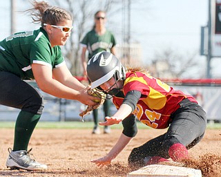 William D. Lewis The Vindicator  Mooney's #24 is safe at 3rd as Ursuline's (77) tries to make the tag during 4-12-17 game at YSU.