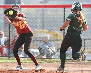 William D. Lewis The Vindicator Ursuline's (1) is ouit at 1rst as Mooney's (23) makes the catch during 4-12-17 game at YSU.