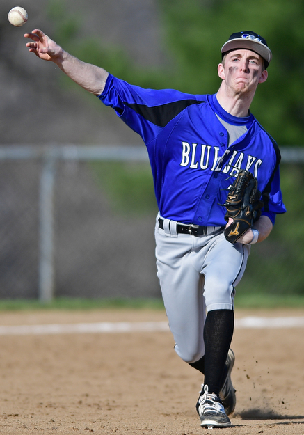McDONALD, OHIO - APRIL 12, 2017: Jackson-Milton third basemen Eric Ostrowski (7) throws to first for the out in the second inning of Wednesday evenings game at Woodland Park. Jackson-Milton won 3-2. DAVID DERMER | THE VINDICATOR