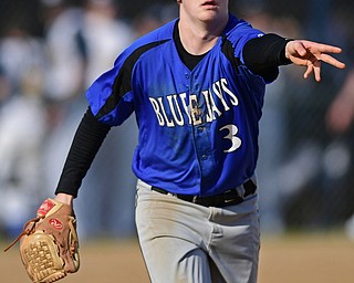 McDONALD, OHIO - APRIL 12, 2017: Jackson Milton starting pitcher Sebastian Lay (3) flips it to first basemen Zach Socha, not pictured, of Wednesday evenings game at Woodland Park. Jackson-Milton won 3-2. DAVID DERMER | THE VINDICATOR