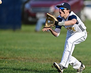 McDONALD, OHIO - APRIL 12, 2017: McDonald's Nick Shiley gets under the fly ball for the out in the fourth inning of Wednesday evenings game at Woodland Park. Jackson-Milton won 3-2. DAVID DERMER | THE VINDICATOR