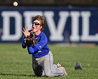 McDONALD, OHIO - APRIL 12, 2017: Jackson-Milton's Scott Mitchell (2) dives to catch the ball for the out in the fourth inning of Wednesday evenings game at Woodland Park. Jackson-Milton won 3-2. DAVID DERMER | THE VINDICATOR