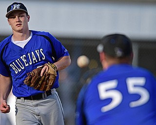 McDONALD, OHIO - APRIL 12, 2017: Jackson-Milton relief pitcher Noah Laster, left, flips the ball to first basemen Zach Socha, right, for the out in the fourth inning of Wednesday evenings game at Woodland Park. Jackson-Milton won 3-2. DAVID DERMER | THE VINDICATOR