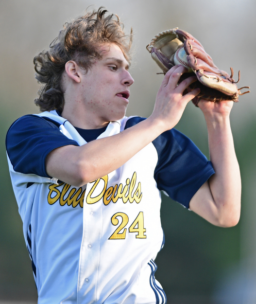 McDONALD, OHIO - APRIL 12, 2017: McDonald's Nate Ifft catches a flay ball in shallow left field for the out in the seventh inning of Wednesday evenings game at Woodland Park. Jackson-Milton won 3-2. DAVID DERMER | THE VINDICATOR
