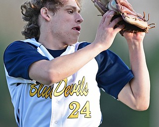 McDONALD, OHIO - APRIL 12, 2017: McDonald's Nate Ifft catches a flay ball in shallow left field for the out in the seventh inning of Wednesday evenings game at Woodland Park. Jackson-Milton won 3-2. DAVID DERMER | THE VINDICATOR
