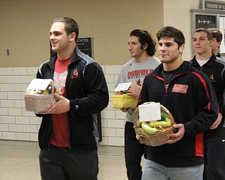 Neighbors | Abby Slanker.In a Canfield tradition, state qualified wrestlers Anthony D'Alesio, Georgio Poullas, David Crawford, Dominic Cooper, Tyler Stein and Mason Giordano were honored by and wished good luck by their classmates, faculty, staff and family members at a walk-through at the high school on March 8.