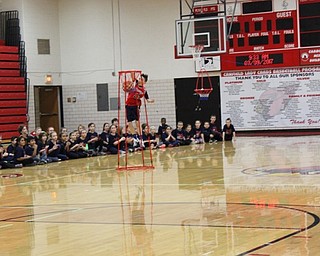 Neighbors | Abby Slanker.C.H. Campbell Elementary School third-grade student Bryce Roberts finished his basketball dribbling skills performance with a slam dunk at the school’s annual Third Grade Gym Show in the high school gymnasium on March 9.