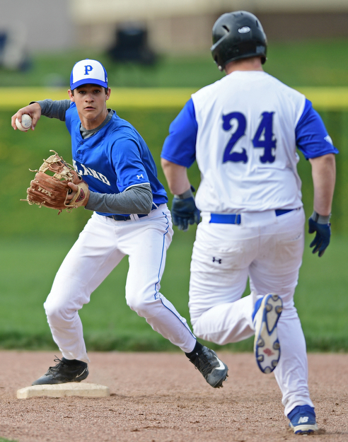 HUBBARD, OHIO - APRIL 13, 2017: Poland's Braeden O'Shaughnessy, left, steps on second to force out Hubbard's Caleb Johnson, right, before unsuccessfully attempting to turn a double play in the third inning of Thursday evenings game at Hubbard High School. DAVID DERMER | THE VINDICATOR