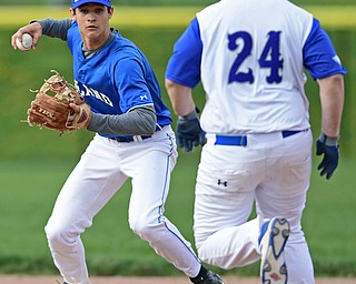 HUBBARD, OHIO - APRIL 13, 2017: Poland's Braeden O'Shaughnessy, left, steps on second to force out Hubbard's Caleb Johnson, right, before unsuccessfully attempting to turn a double play in the third inning of Thursday evenings game at Hubbard High School. DAVID DERMER | THE VINDICATOR