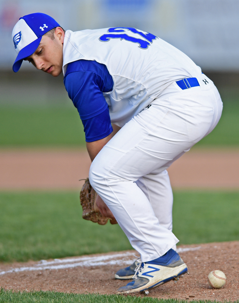 HUBBARD, OHIO - APRIL 13, 2017: Hubbard relief pitcher Lukas Mosora attempts to find the baseball after he knocked down a comebacker in the sixth inning of Thursday evenings game at Hubbard High School. DAVID DERMER | THE VINDICATOR