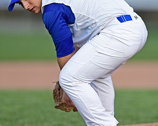 HUBBARD, OHIO - APRIL 13, 2017: Hubbard relief pitcher Lukas Mosora attempts to find the baseball after he knocked down a comebacker in the sixth inning of Thursday evenings game at Hubbard High School. DAVID DERMER | THE VINDICATOR