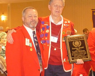 Larry Jensen, member of Austintown Lions Club, received the Past District Governor’s Award during the March 17 through 19 District 13 OH-4 Lions Club Convention at the Clarion Inn, Hudson, Ohio. The award is given to a member who exemplifies the ideals and philosophies of Lions Club International, and the recipient is chosen by the district’s Past District Governors Association. Jensen, left, received the award from Tom Zickefoose, past district governor. District 13 OH-4 includes 60 clubs in Mahoning, Trumbull, Ashtabula, Lake, Geauga, Portage, Stark and Carroll counties. SPECIAL TO THE VINDICATOR
