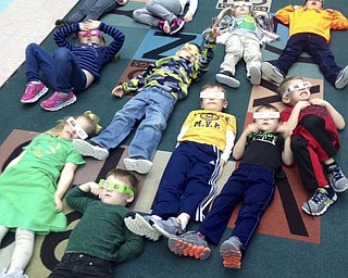 Students in Barbara Conti’s preschool enrichment class at Ursuline Preschool and Kindergarten in Canfield learned about rainbows on St. Patrick’s Day. They wore 3-D glasses to see more of the color spectrum. SPECIAL TO THE VINDICATOR