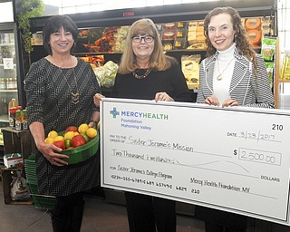 SPECIAL TO THE VINDICATOR
Mercy Health Foundation Mahoning Valley, Boardman, recently donated $2,500 to Sister Jerome’s Mission College, a program of Ursuline Sisters of Youngstown, to improve the nutrition of college students in the mission program. Present for the donation at Cultivate, Lake to River Food Cooperative Cafe in Youngstown, were Melissa Miller, of Lake to River; Crystal Jones, executive director of grants and contracts for Mercy Health Foundation; and Maraline Kubik, director of Sister Jerome’s Mission. The mission helps first-generation college students from low-income families finish their degrees with financial assistance and mentoring. The grant will provide each student with $25 each month to purchase fresh fruit, vegetables, dairy products and meat from Lake to River, and grocery vouchers instead of fast-food gift cards the students have been receiving. The mission is funded entirely from donations, and all the mentors are volunteers. For information or to donate, call 330-746-6622.