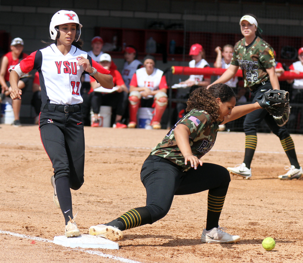 William D. Lewis The Vindicator YSU's Hannah Lucas(22) is safe at 1rst as WSU's Alexis Mayle(24) looses the ball during 4-18-17 game at YSU. Her hit drove in YSU's first run of the win over WSU.
