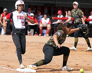 William D. Lewis The Vindicator YSU's Hannah Lucas(22) is safe at 1rst as WSU's Alexis Mayle(24) looses the ball during 4-18-17 game at YSU. Her hit drove in YSU's first run of the win over WSU.