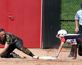 William D. Lewis The Vindicator  YSU's Hsnnah Lucas(22) is safe at 3rd a WSU's Libby Pfeffer(21) misses the throw during 4-18-17 game at YSU.