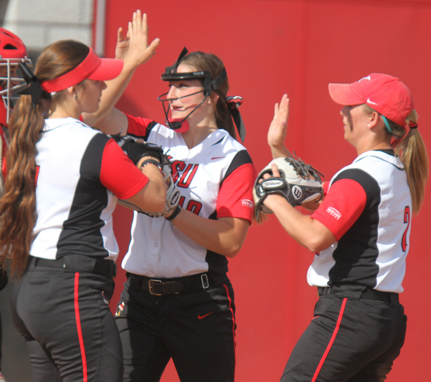 William D Lewis The Vindicator YSU pitcher Maddi Lusk(10),center, reacts with Kelly Thompson-Cappadocio(7), left, and Brittney Moffatt(2) during 4-18 win over WSU in first gme of a double header at YSU.