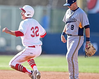 NILES, OHIO - APRIL 18, 2017: Youngstown State's Nico Padovan, left, steals second base in front of Kent State's Dom Iero in the second inning of their game Tuesday evenings game at Eastwood Field. Kent State won 6-3. DAVID DERMER | THE VINDICATOR