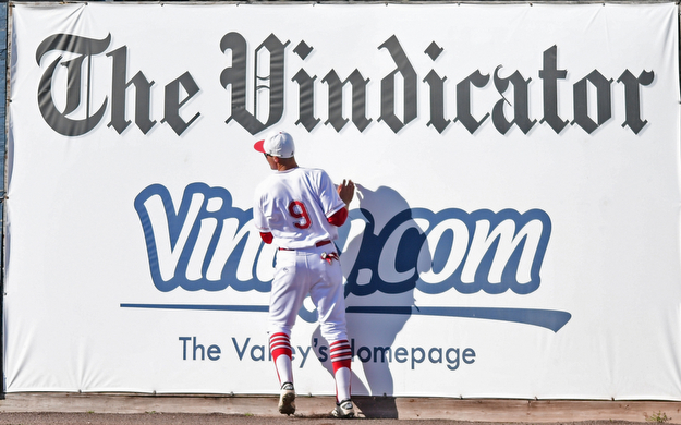 NILES, OHIO - APRIL 18, 2017: Youngstown State's Lorenzo Arcuri (9) collides with the wall after catching a ball on the warning track in the third inning of Tuesday evenings game at Eastwood Field. Kent State won 6-3. DAVID DERMER | THE VINDICATOR