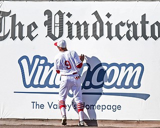 NILES, OHIO - APRIL 18, 2017: Youngstown State's Lorenzo Arcuri (9) collides with the wall after catching a ball on the warning track in the third inning of Tuesday evenings game at Eastwood Field. Kent State won 6-3. DAVID DERMER | THE VINDICATOR