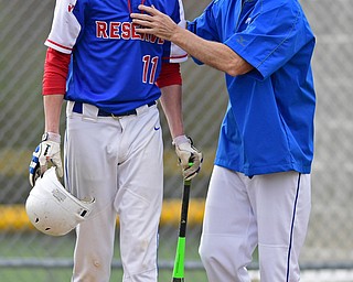 BERLIN CENTER, OHIO - APRIL 19, 2017: Western Reserve's Matt Burcaw is helps off the field by head coach Ed Anthony after fouling a baseball off his face causing a deep gash in the second inning of Wednesday evenings game at Western Reserve High School. DAVID DERMER | THE VINDICATOR