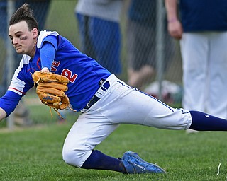 BERLIN CENTER, OHIO - APRIL 19, 2017: Western Reserve's Jeep DiCioccio (2) dives to catch a pop up in foul territory after a bunt attempt by McDonald's Joey Celli, not pictured, in the fifth inning of Wednesday evenings game at Western Reserve High School. DAVID DERMER | THE VINDICATOR