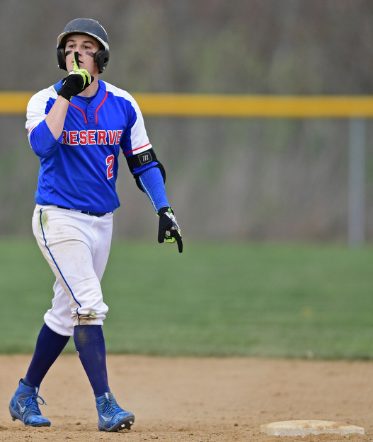 BERLIN CENTER, OHIO - APRIL 19, 2017: Western Reserve's Jeep DiCioccio (2) quiets the crowd after hitting a RBI double in the fifth inning of Wednesday evenings game at Western Reserve High School. DAVID DERMER | THE VINDICATOR