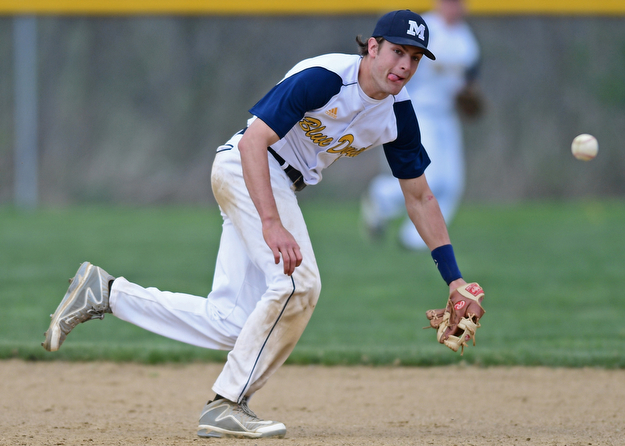 BERLIN CENTER, OHIO - APRIL 19, 2017: McDonald's Dylan Portolese attempts to chase down the ball before it bounces into center field in the fifth inning of Wednesday evenings game at Western Reserve High School. DAVID DERMER | THE VINDICATOR