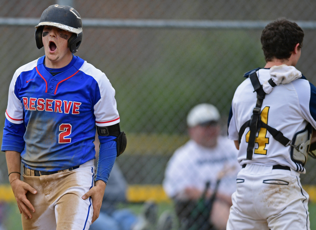 BERLIN CENTER, OHIO - APRIL 19, 2017: Western Reserve's Jeep DiCioccio, left celebrates after scoring a run on a double by Dom Velasquez, not pictured, in the fifth inning of Wednesday evenings game at Western Reserve High School. DAVID DERMER | THE VINDICATOR