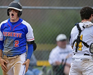 BERLIN CENTER, OHIO - APRIL 19, 2017: Western Reserve's Jeep DiCioccio, left celebrates after scoring a run on a double by Dom Velasquez, not pictured, in the fifth inning of Wednesday evenings game at Western Reserve High School. DAVID DERMER | THE VINDICATOR