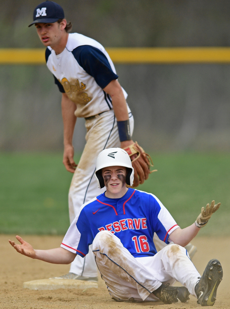 BERLIN CENTER, OHIO - APRIL 19, 2017: Western Reserve's Josh Slaton, bottom, shows his frustration after being tagged out by McDonald's Logan Shields, not pictured, in the fifth inning of Wednesday evenings game at Western Reserve High School. DAVID DERMER | THE VINDICATOR..McDonald's Dylan Portolese pictured.