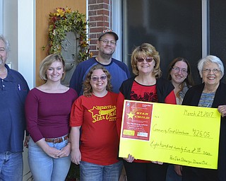 SPECIAL TO THE VINDICATOR
Shenango Drama Club recently donated $825 to Community Food Warehouse of Mercer County, Sharon, Pa. Jeanne Zingale, professor of communications at Penn State Shenango and the club adviser, presented the check to Mimi Prada, public relations coordinator for the warehouse. The funds were raised by the club’s holiday production, “Star Child,” which was written and directed by Zingale. The club has donated thousands of dollars and non-perishable food items to the warehouse, and to AWARE of Mercer County. Present for the donation, from left, were Ron Cadman, Corinn Stonebracker, Erin Stoops, Leon Nichols, Prada, Katherine Shacklock and Zingale.