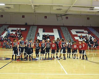 Neighbors | Alexis Bartolomucci.The fifth-grade boys' basketball teams lined up as they prepared for the students versus staff basketball game fundraiser for Ray "Flash" Gordon on March 20.