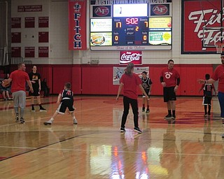 Neighbors | Alexis Bartolomucci.Austintown staff played against the fifth-grade boys' basketball teams on March 20 to raise money for head custodian, Ray "Flash" Gordon, at Fitch High School.