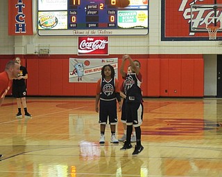 Neighbors | Alexis Bartolomucci.One of the fifth-grade students took a foul shot during the staff versus students basketball game at Austintown Fitch on March 20.