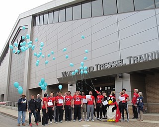 Neighbors | Alexis Bartolomucci.Mahoning County Meals on Wheels members and Youngstown State University student-athletes let go of their balloons during the March for Meals balloon launch on March 20.