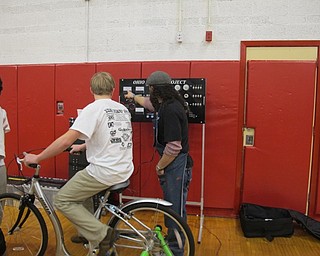 Neighbors | Alexis Bartolomucci.One of the Cardinal Mooney students rode the bike that the Oh Wow Children's Museum brought in during Yes Fest on March 22.
