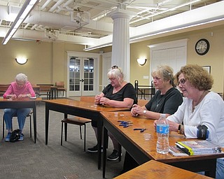 Neighbors | Alexis Bartolomucci.Guests at the Poland library made a pair of earrings during an Easter Egg Earrings program on April 10.