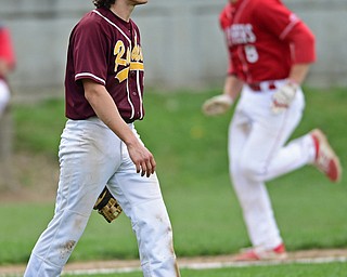 COLUMBIANA, OHIO - APRIL 20, 2017: South Range relief pitcher Ethan Dominguez, left, shows his frustration after a outfielder misplayed the ball allowing Columbiana's Keenan Green to score in the fifth inning of Thursday evenings game at Firestone Park. Columbiana won 4-2. DAVID DERMER | THE VINDICATOR