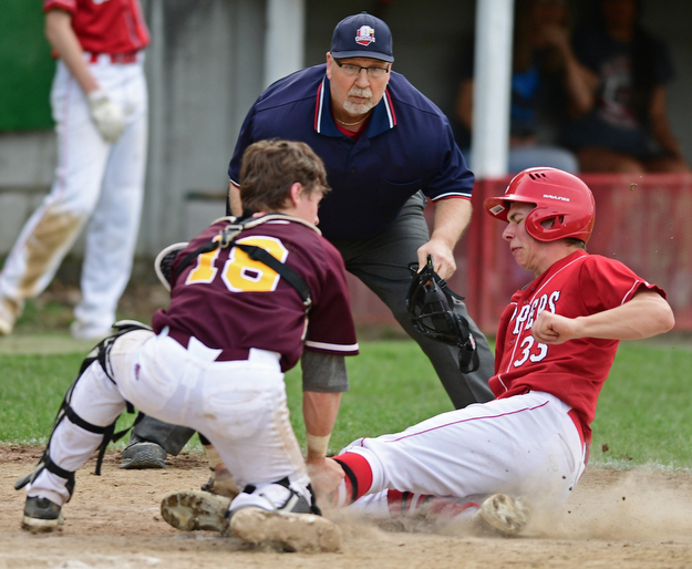 COLUMBIANA, OHIO - APRIL 20, 2017: Columbiana's A.J. Perkins, right, is tagged out at home by South Range's M.J. Lucas preventing a run in the fifth inning of Thursday evenings game at Firestone Park. Columbiana won 4-2. DAVID DERMER | THE VINDICATOR