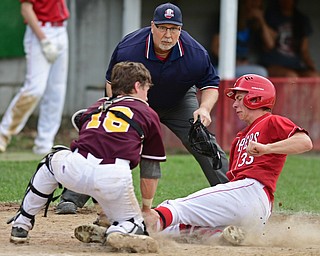 COLUMBIANA, OHIO - APRIL 20, 2017: Columbiana's A.J. Perkins, right, is tagged out at home by South Range's M.J. Lucas preventing a run in the fifth inning of Thursday evenings game at Firestone Park. Columbiana won 4-2. DAVID DERMER | THE VINDICATOR